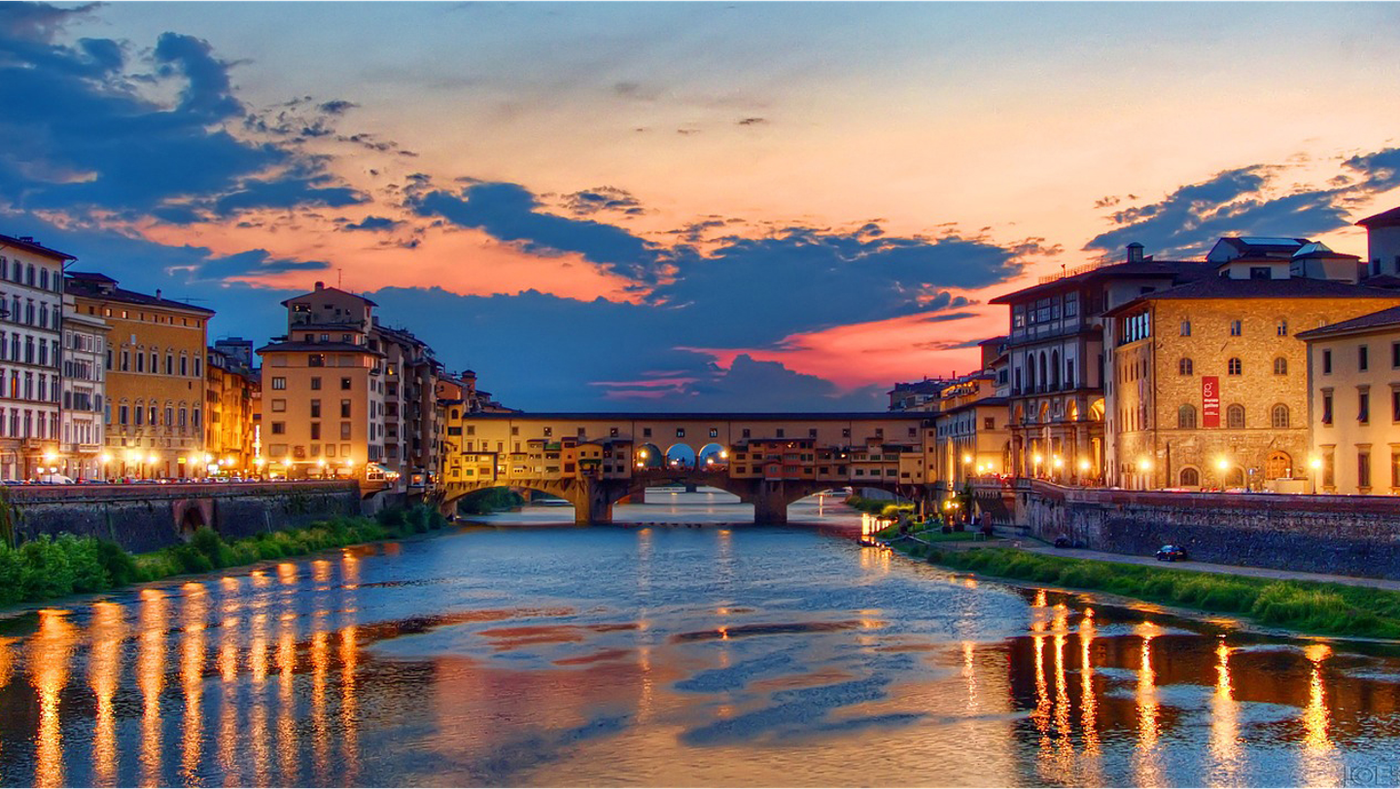 Panoramic view of Florence city center, encircled by the Apennines. The Basilica of Santa Maria Novella towers above all the others medieval buildings.